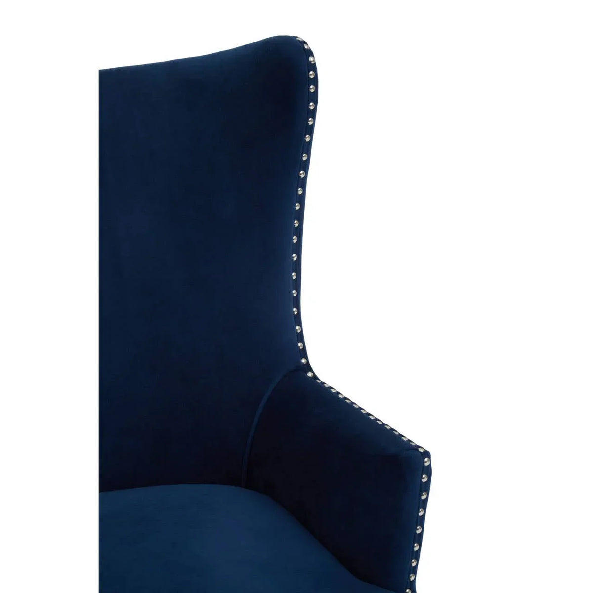 Navy velvet armchair with high back and silver stud detailing on edge