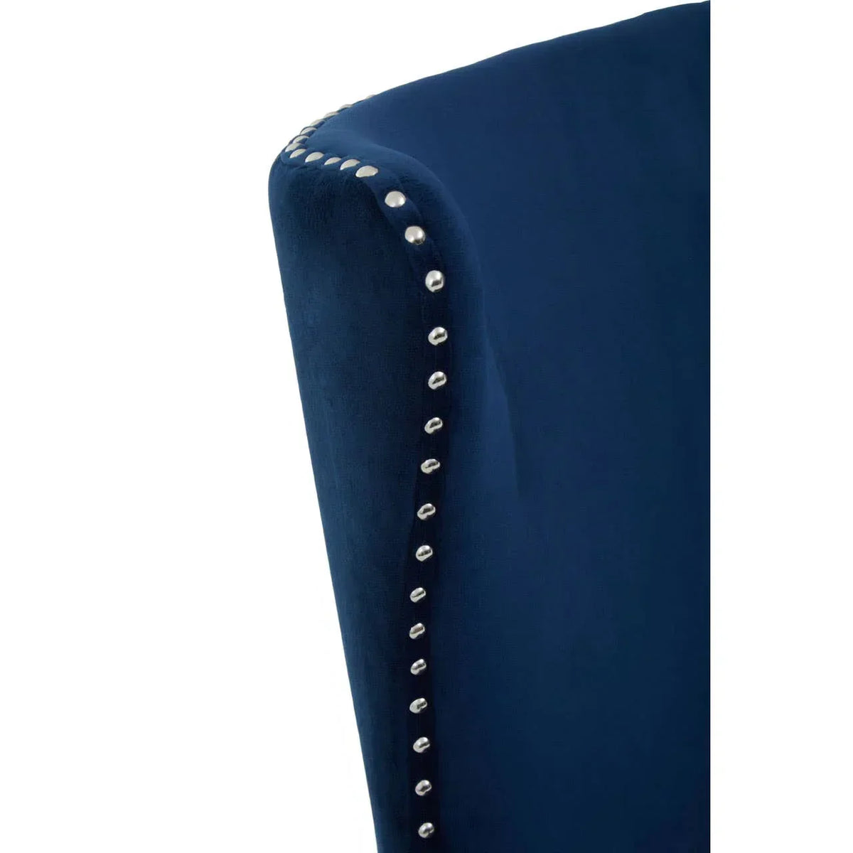 Navy velvet chair back with silver stud detailing, close up of upholstery finish