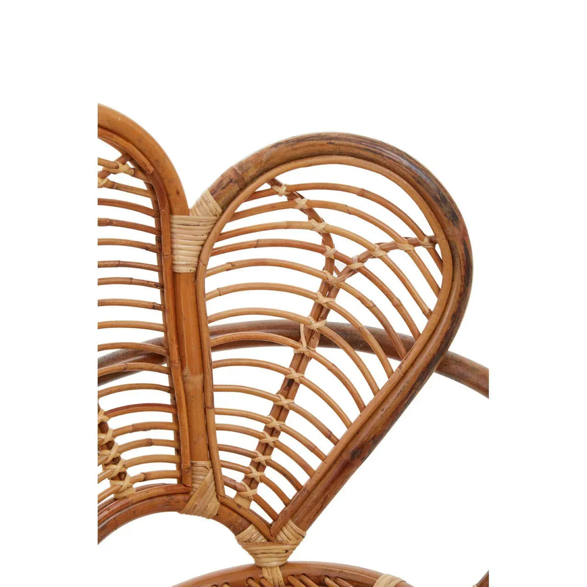 Closeup of natural rattan chair back with curved woven detail