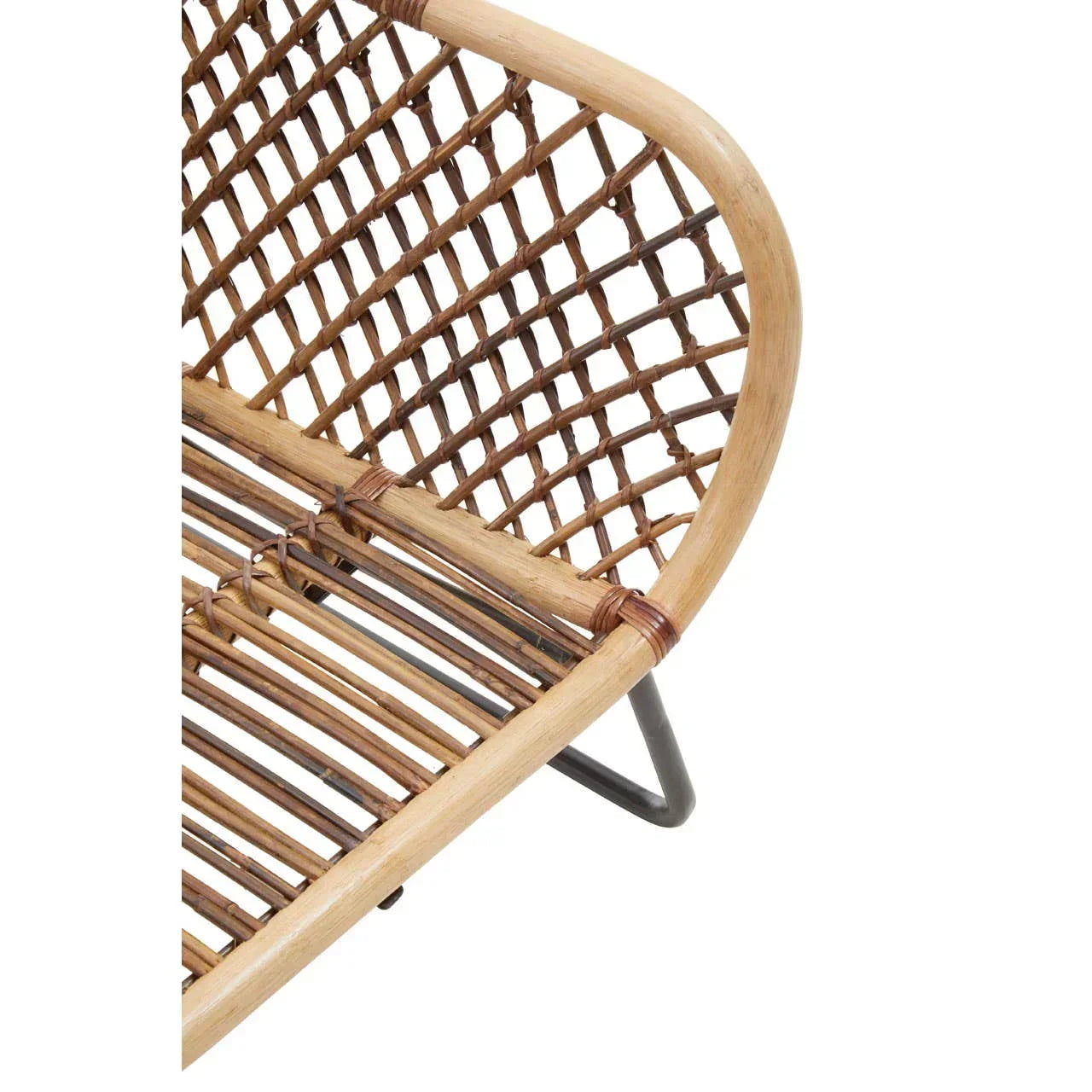 Close-up of rattan chair seat and curved armrest with black metal legs