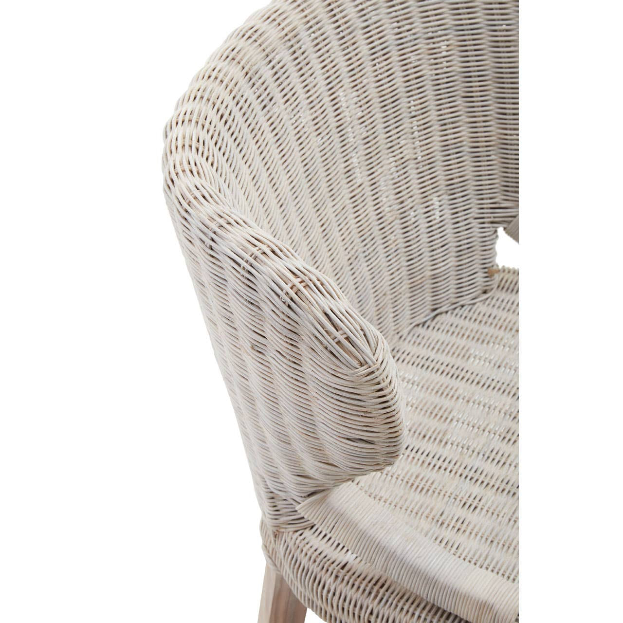 A close-up view of the Manado Wicker Chair showcasing its textured woven seat and backrest in a light, natural color, with a curved armrest and wooden legs