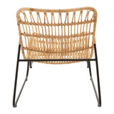 A rattan chair with a curved backrest and open weave design, supported by a sleek black metal frame, accompanied by a matching footstool. The chair features a natural finish, showcasing the texture of the rattan