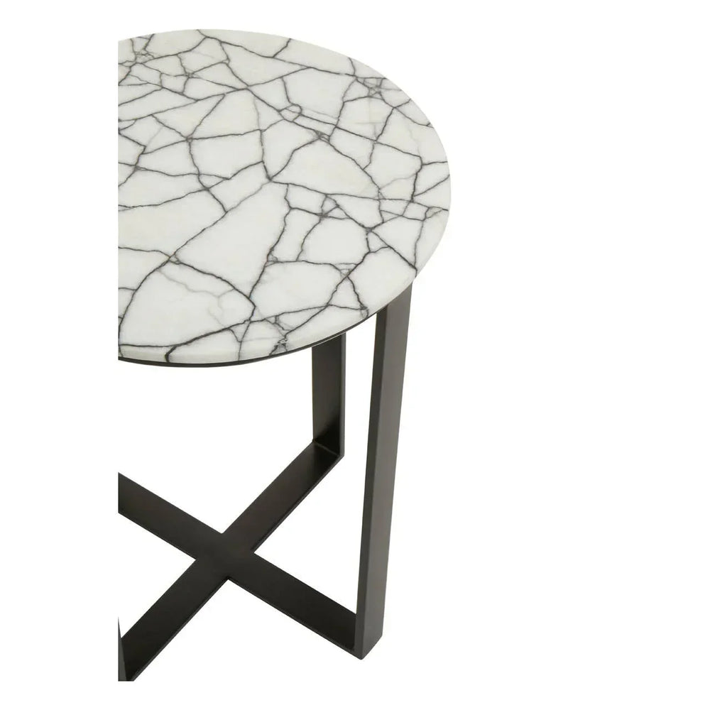Round marble side table with black metal cross base, close-up of tabletop and legs