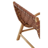 Close-up of wooden chair with woven brown leather backrest and angled frame