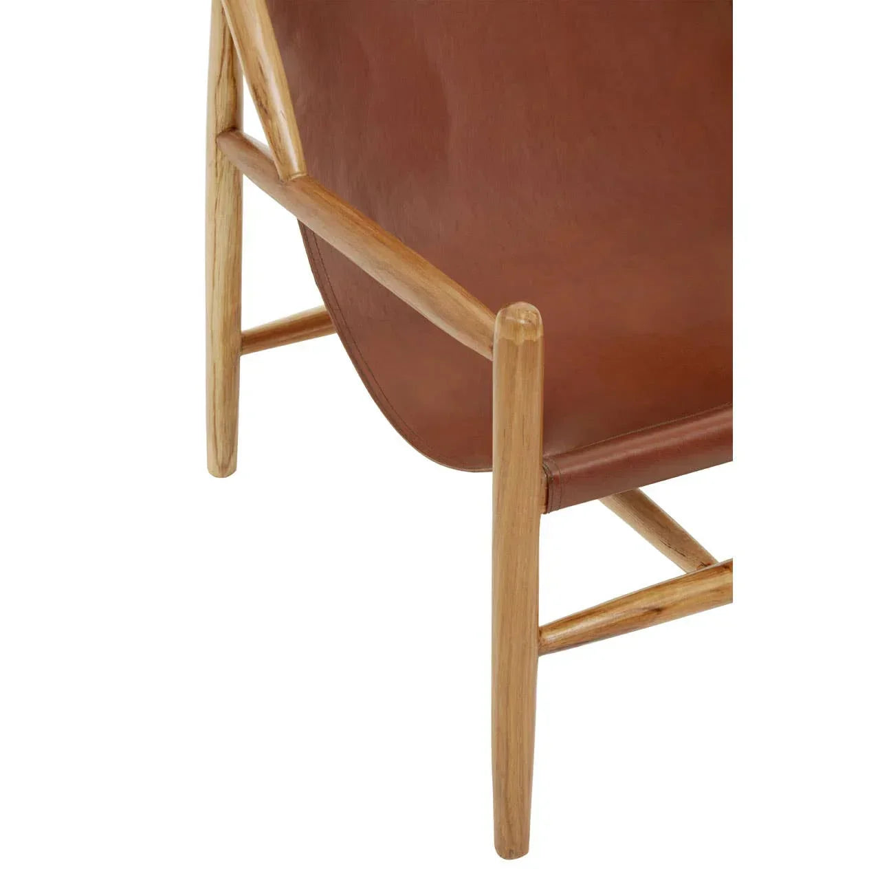 Closeup of brown leather accent chair with light wood frame and angled legs
