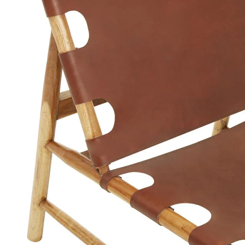 Side view of wooden lounge chair with brown leather seat and backrest