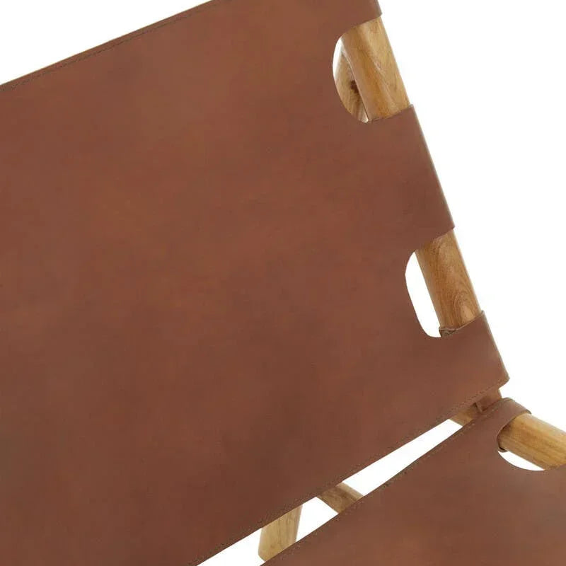 Closeup of tan leather chair seat and backrest with light wood frame