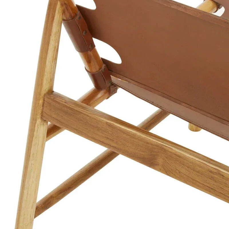 Close-up of wooden chair frame with brown leather seat and angled backrest