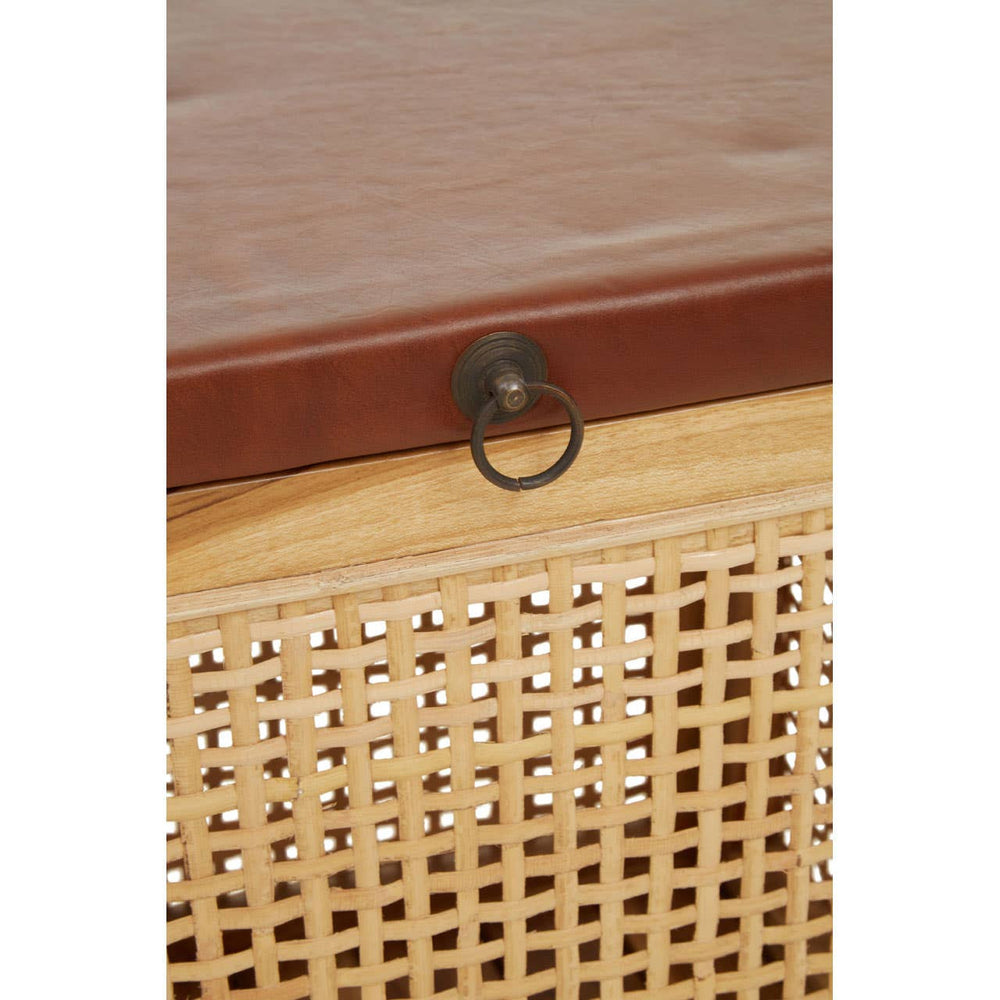 A close-up view of a Kendari Rattan and Leather Storage Box Side Table featuring a smooth leather top and a woven rattan body. The front has a decorative metal ring pull for easy access to the storage compartment. The natural tones of the rattan contrast with the rich leather finish