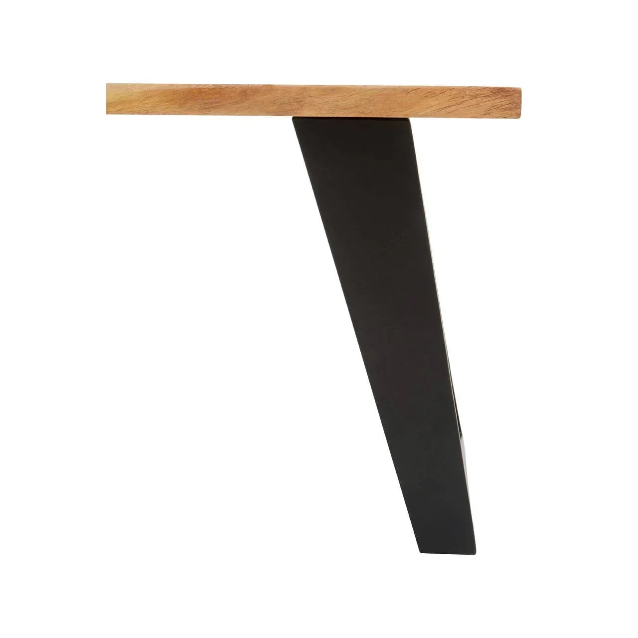 Dining table with angled black metal leg and natural wood top, side close-up view