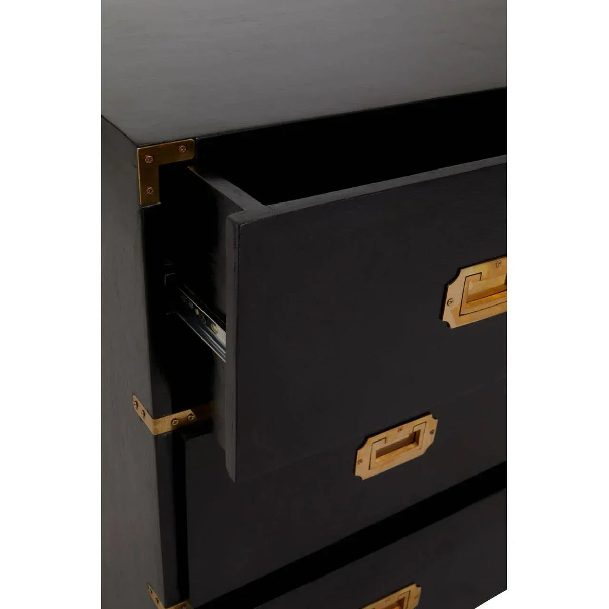 Black chest of drawers with brass handles and open top drawer, corner bracket detail