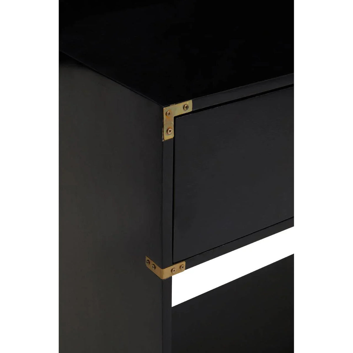 Black wooden cabinet with brass corner brackets, close-up of drawer and side panel