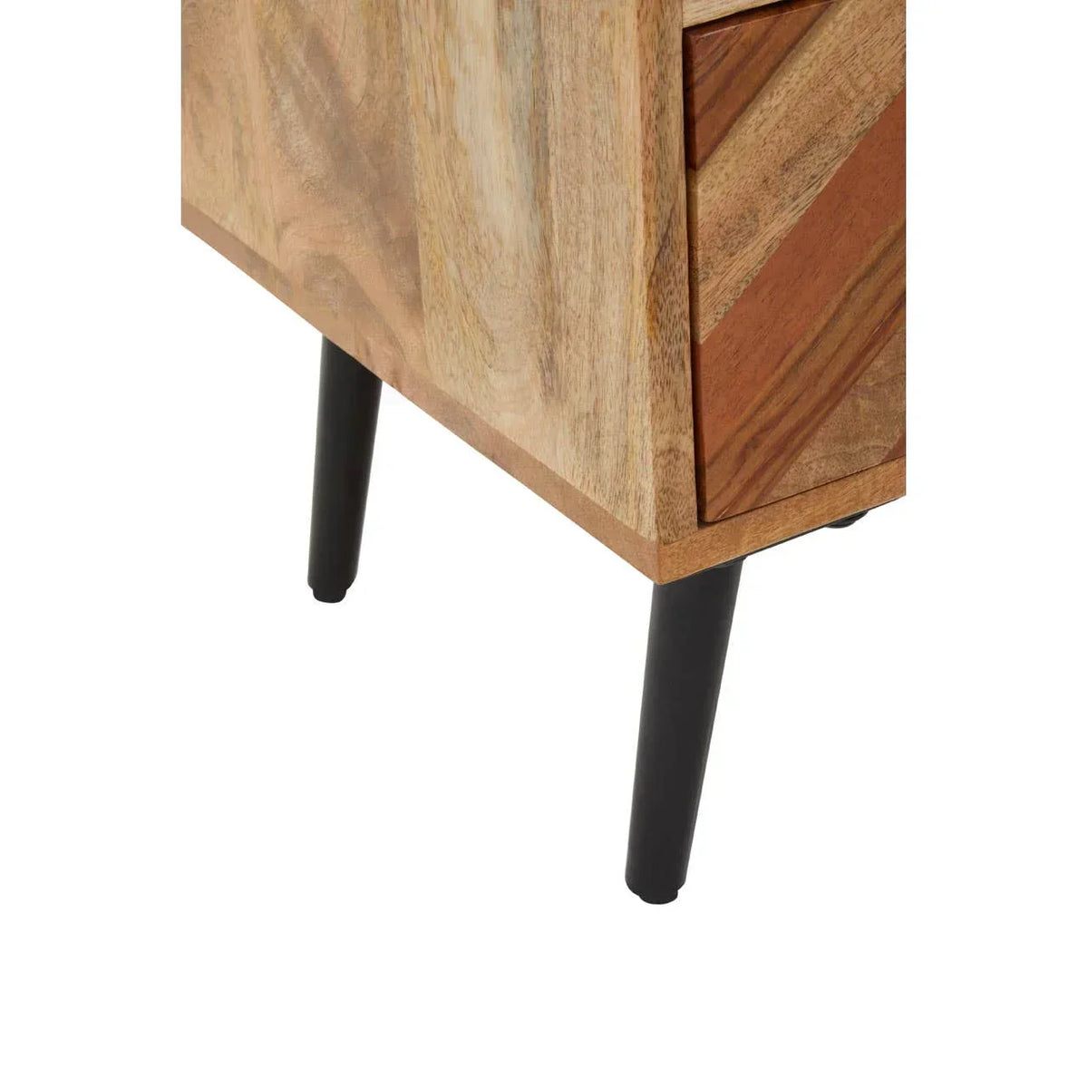 Close-up of wooden furniture leg and drawer with black metal legs and chevron wood detail