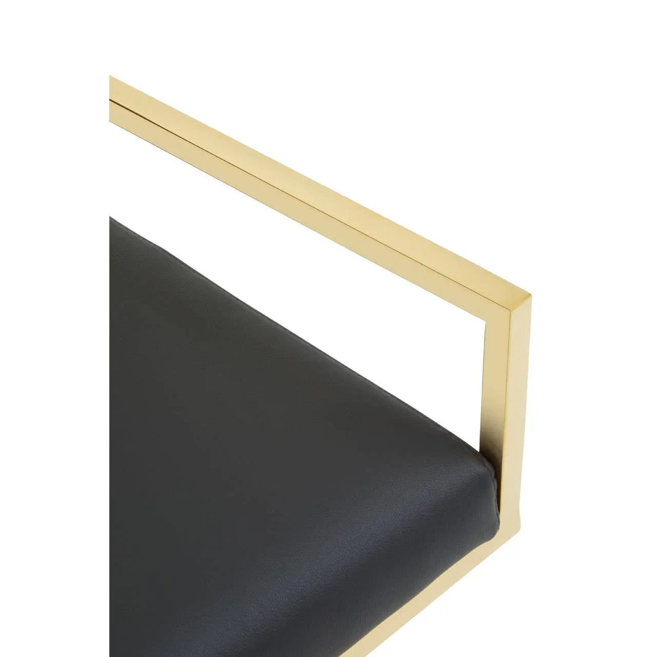 Black leather chair seat with gold metal arm detail, close-up furniture view