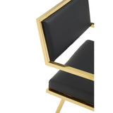 Black leather dining chair with gold metal frame close-up