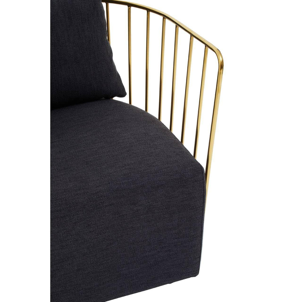 Close up of black fabric sofa with gold metal armrest and cushion