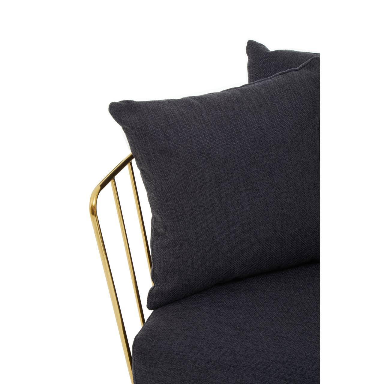 Close up of dark fabric sofa with gold metal armrest and matching cushions