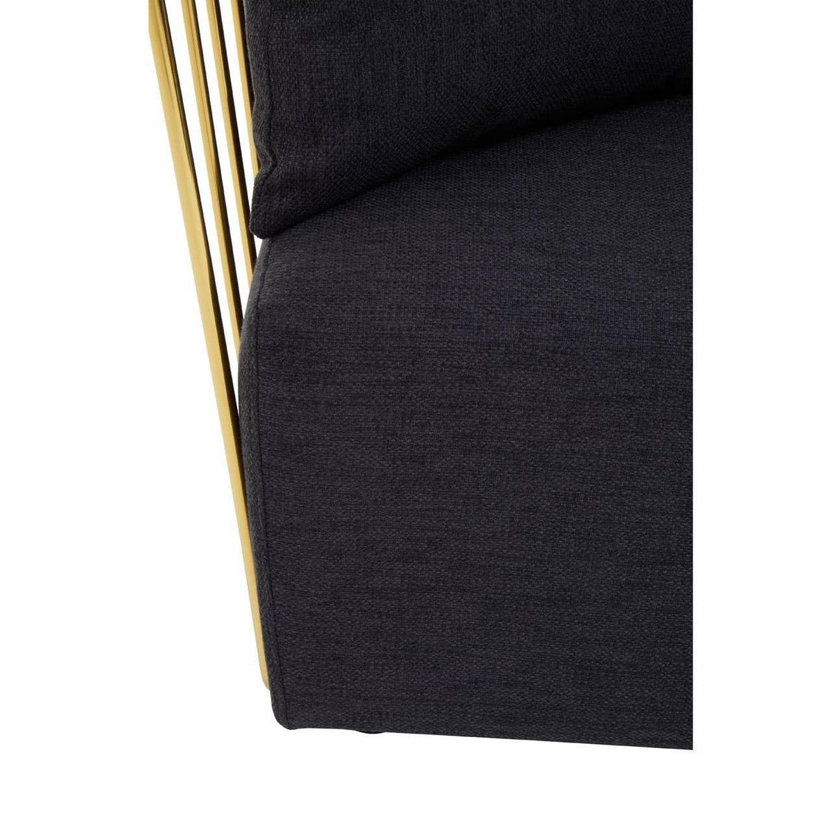 Close detail of dark fabric sofa seat with gold metal frame