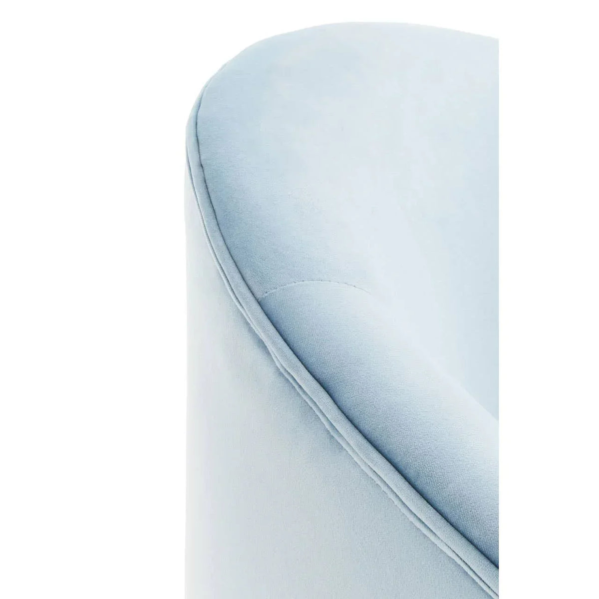 Close-up of light blue velvet chair armrest with visible stitching detail