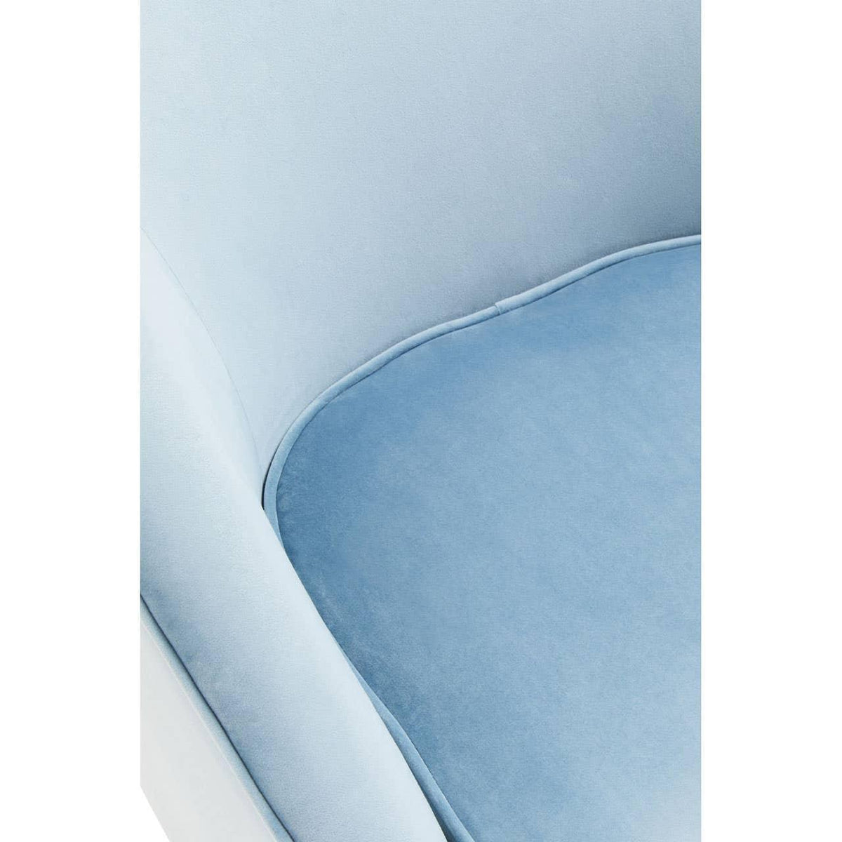 Close-up of light blue velvet armchair seat cushion and upholstery