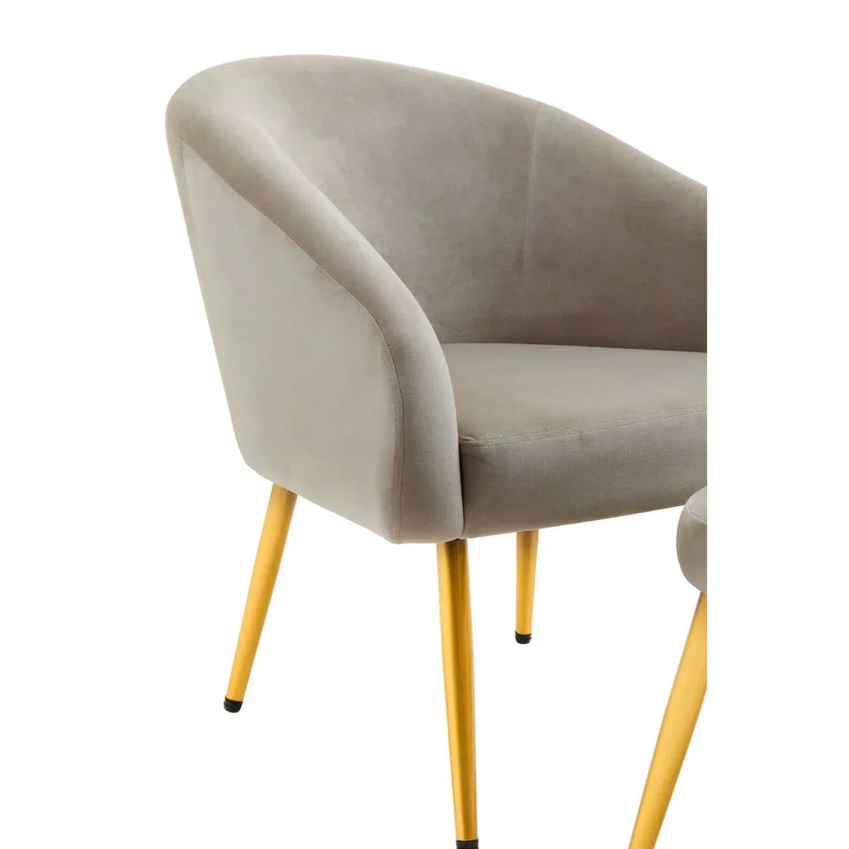 Grey velvet accent chair with curved backrest and gold metal legs, angled front view