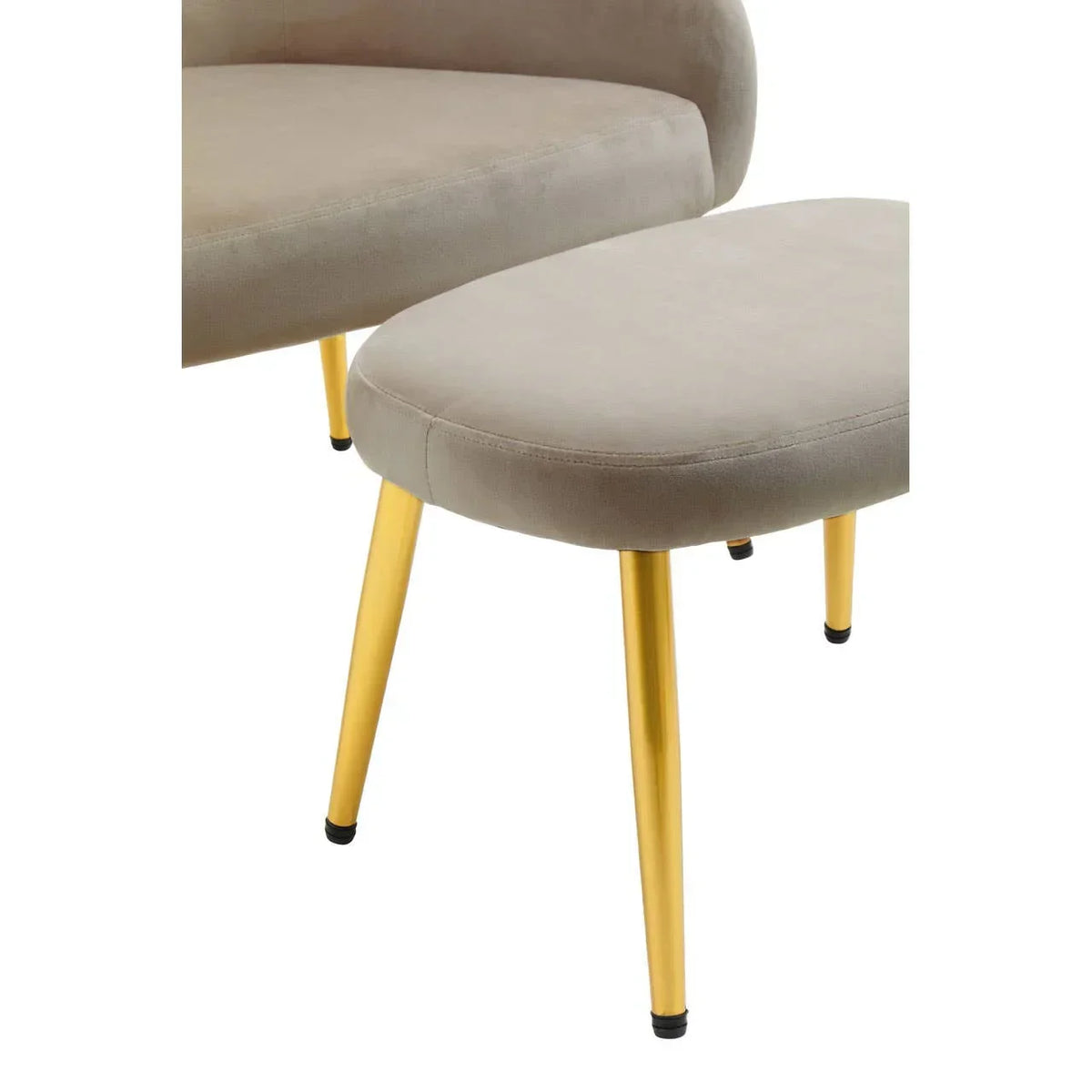 Beige velvet accent chair and footstool with gold metal legs, close-up of seating