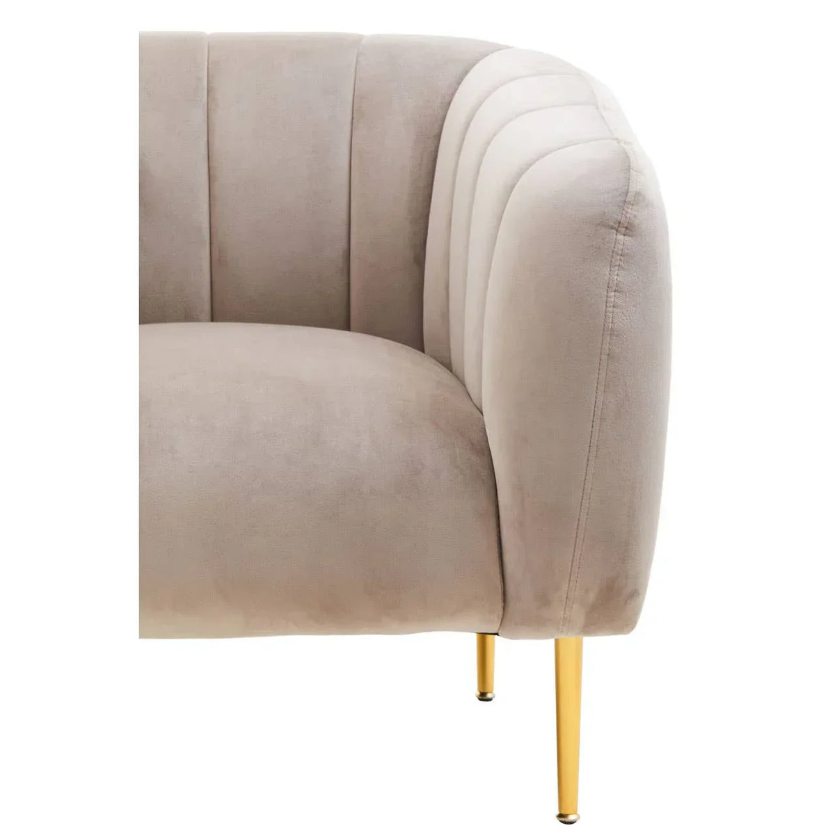 Close-up beige velvet sofa with gold metal legs and curved, stitched backrest