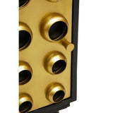 Close-up view of the Arti Mango Wood and Brass Effect One Door Cabinet, showcasing the cabinet's textured surface with circular brass accents and a sleek handle. The rich wood grain is visible, highlighting the natural beauty of the mango wood