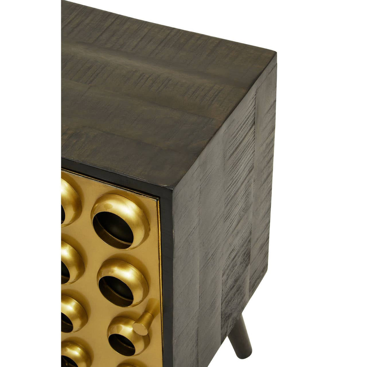 Mango wood cabinet featuring a brass effect door with circular cutouts, showcasing a modern design. The cabinet has a dark wood finish and stands on four tapered legs