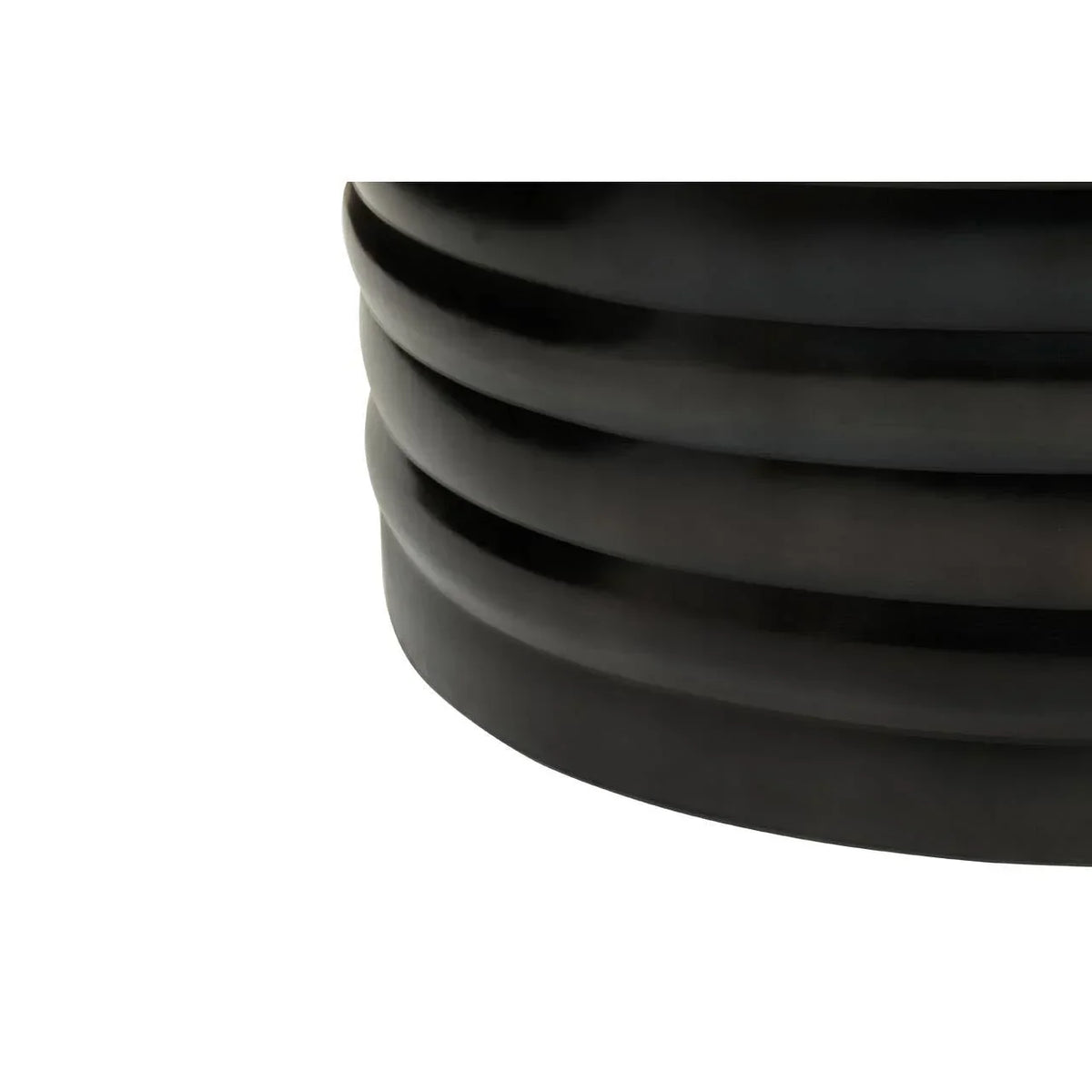 Close-up of black ribbed ceramic planter base detail