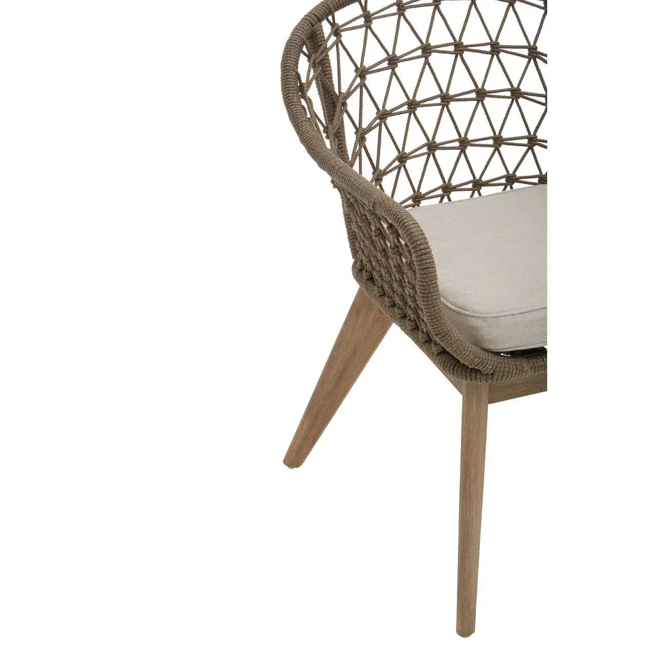 Rattan dining chair with beige seat cushion and wooden legs, close-up of side detail
