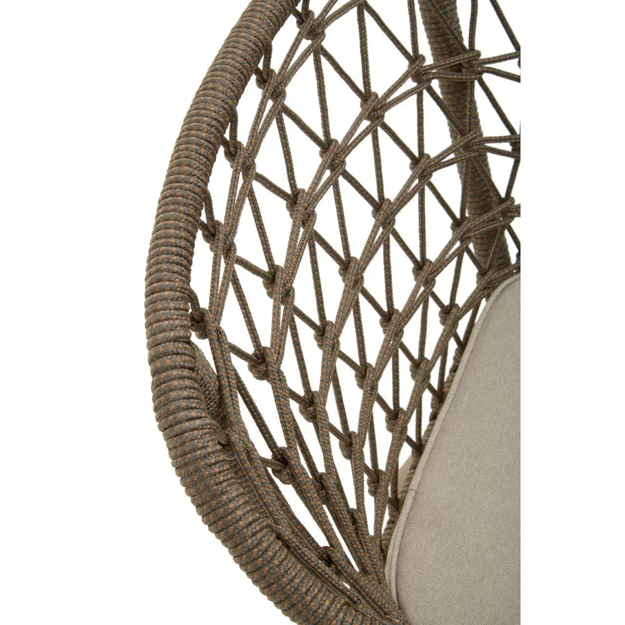 Close-up of woven rattan hanging chair frame with beige cushion
