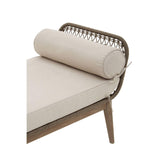 Outdoor daybed with beige cushion, rattan backrest and bolster pillow, angled view