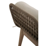 Rattan dining chair with beige cushion and woven rope backrest, angled leg detail visible