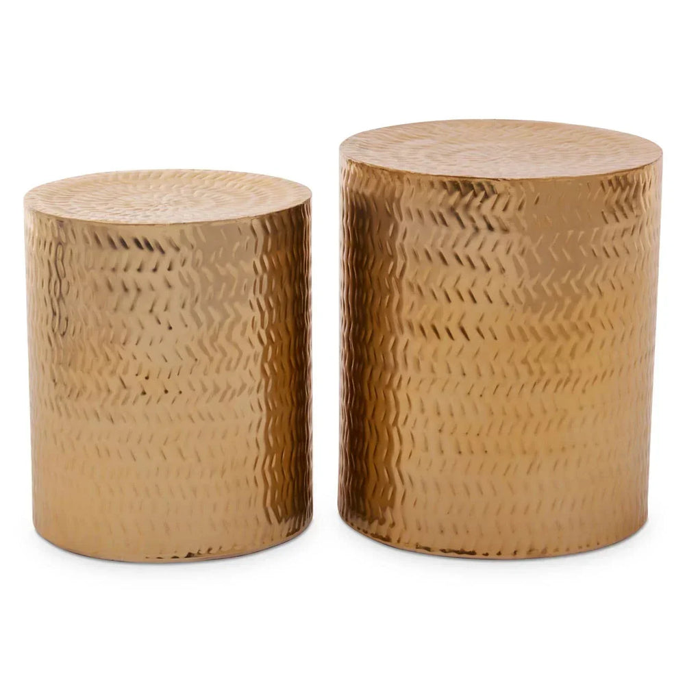 Set of two gold hammered metal drum side tables with textured surface