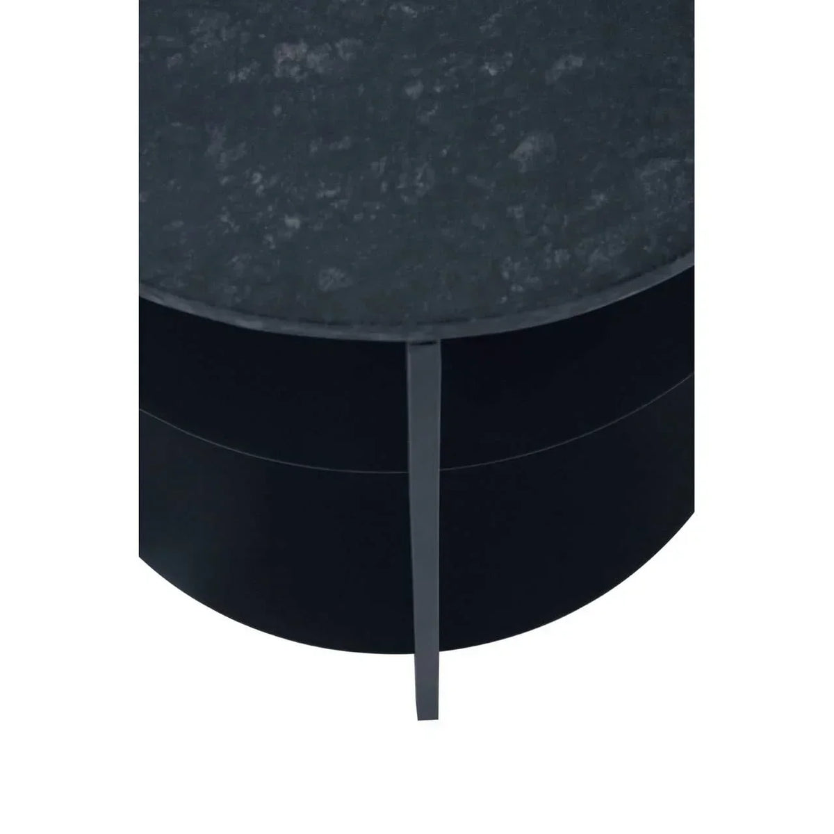 Close-up of round black coffee table with textured stone top and metal leg detail