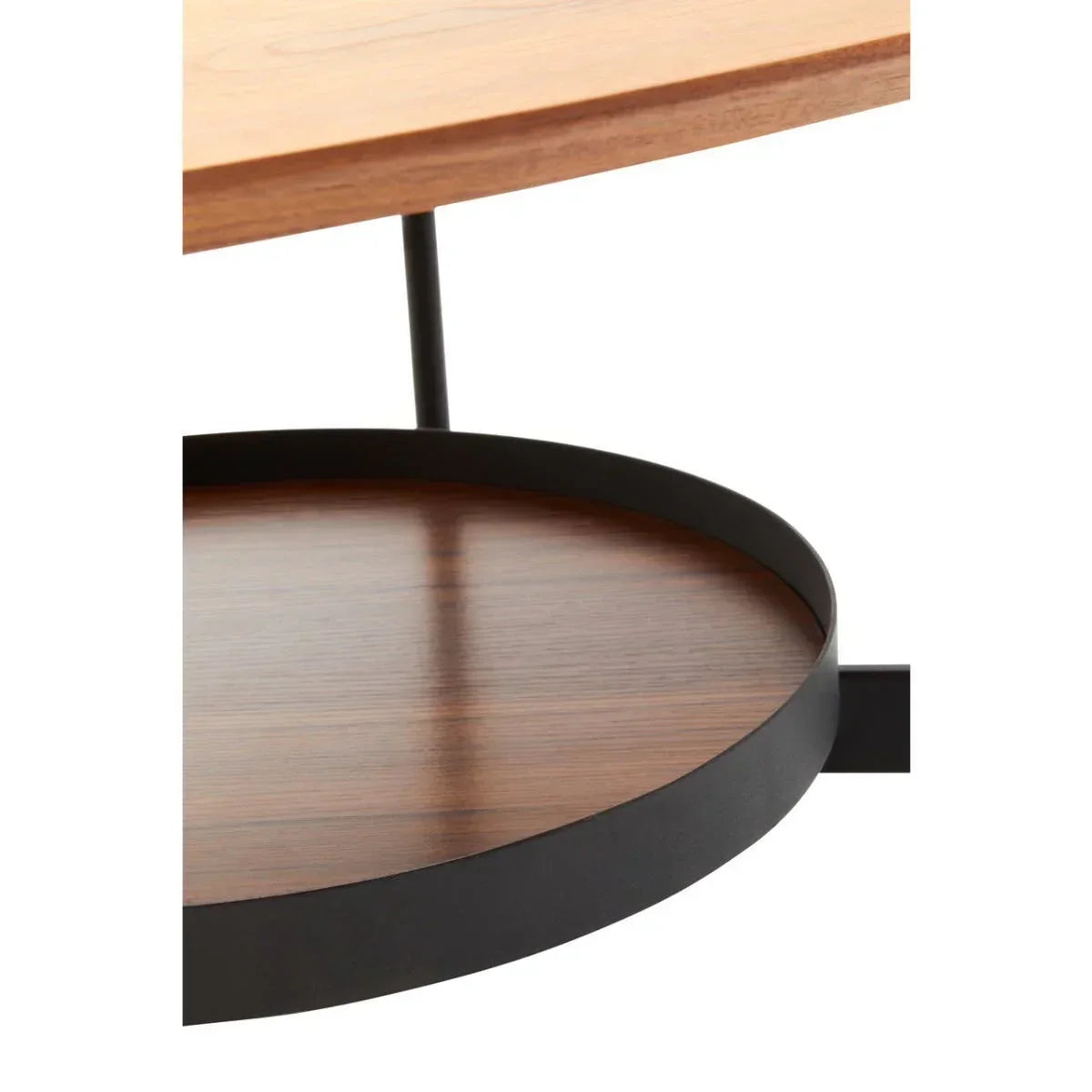 Closeup of wooden coffee table with round black metal shelf and slim support legs