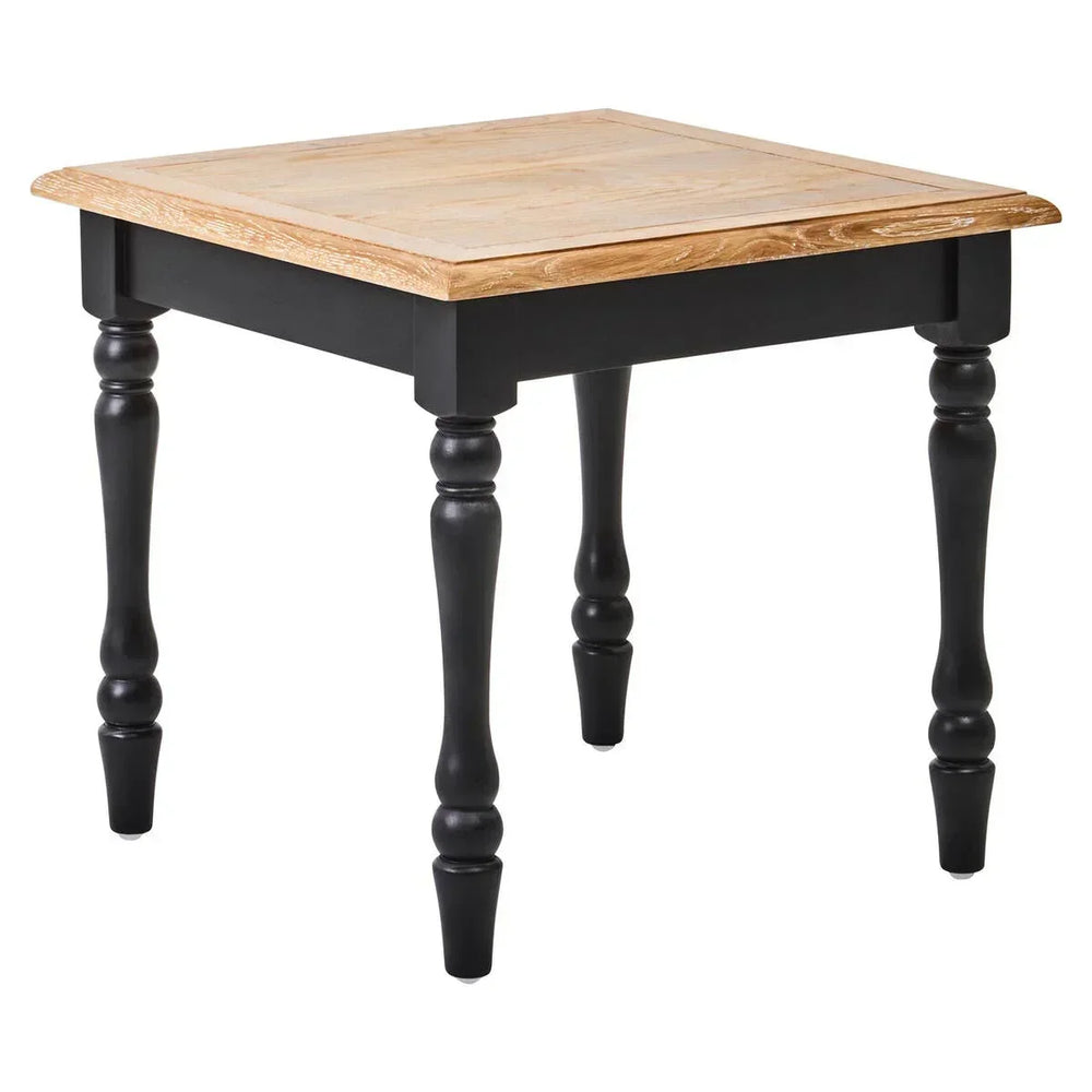 Wooden side table with natural finish top and black turned legs on white background