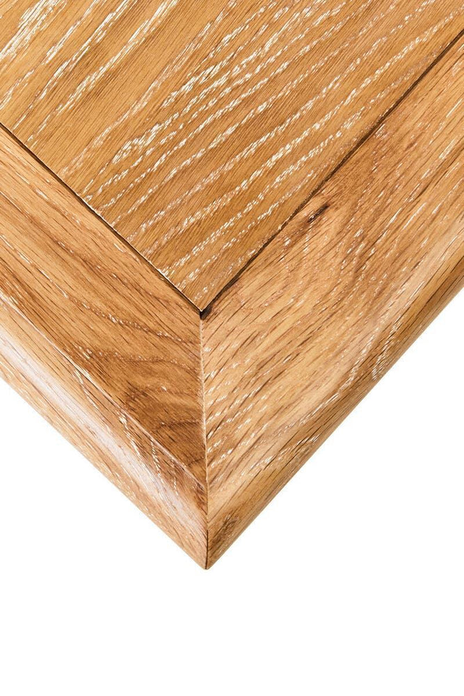 Close up of oak wood furniture corner showing smooth grain and clean edge