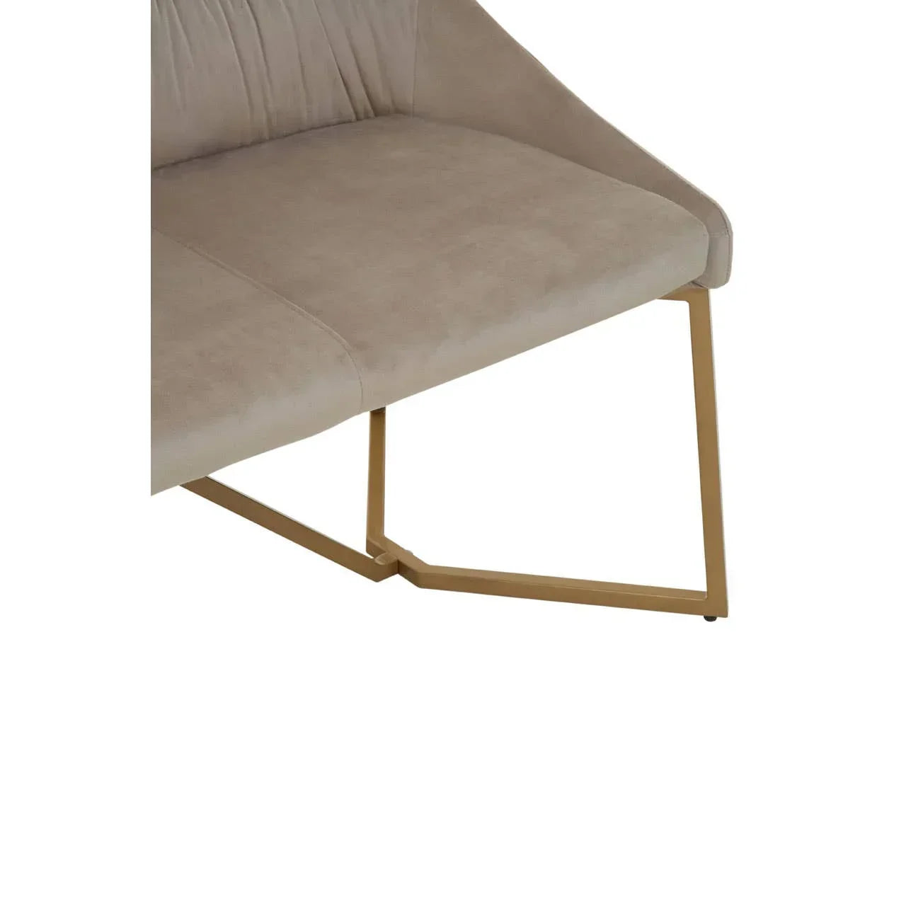 Beige upholstered dining bench with gold metal legs close-up