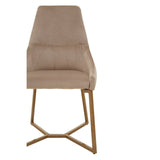 Mink velvet dining chair with a high back and contoured seat, supported by a gold-toned metal frame with an angular design. The chair features a soft, neutral color that complements various decor styles