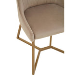 Mink velvet dining chair with a curved backrest and a soft, plush seat, supported by a sleek, gold-toned metal base featuring a unique geometric design