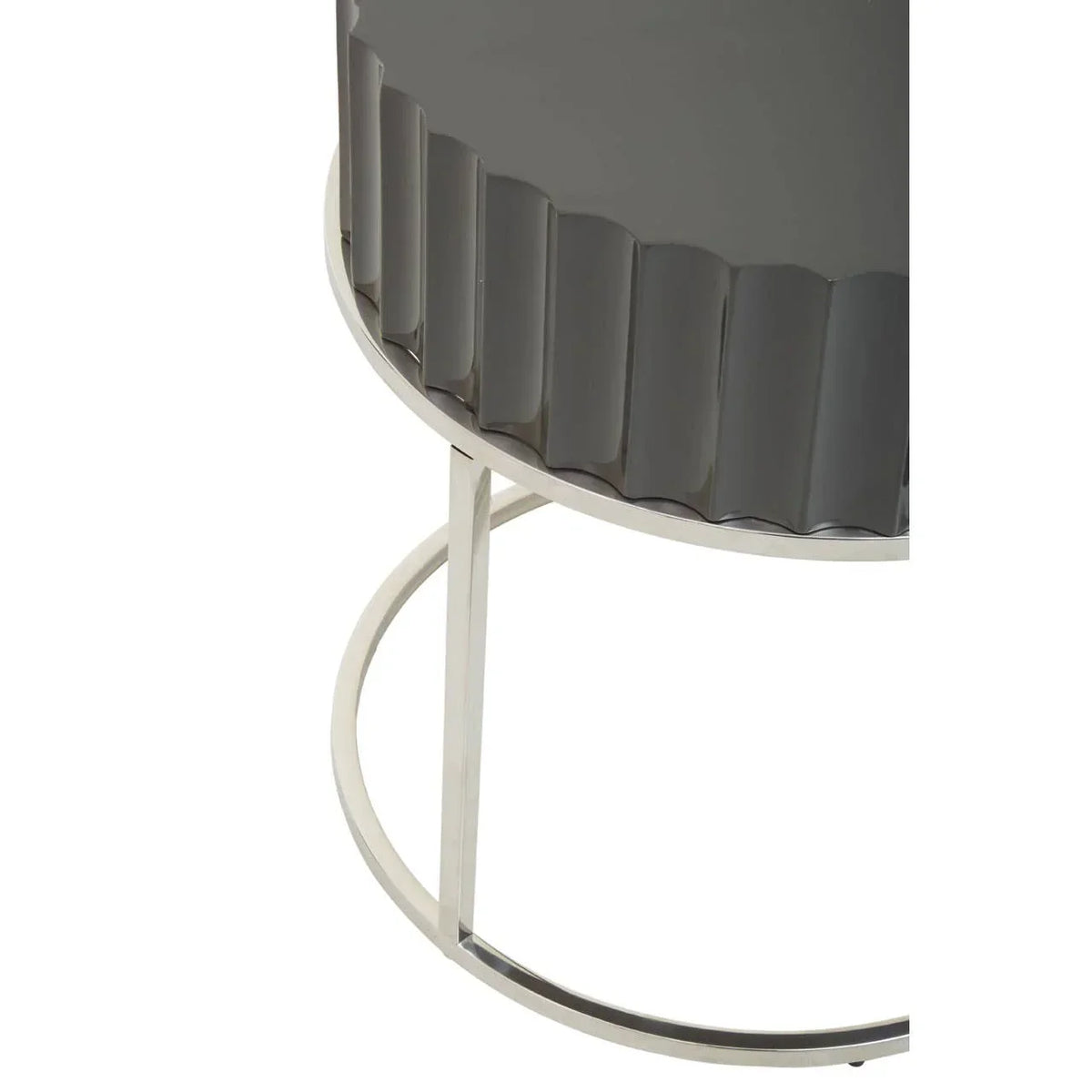 Round side table with glossy grey fluted top and silver metal frame, close-up view