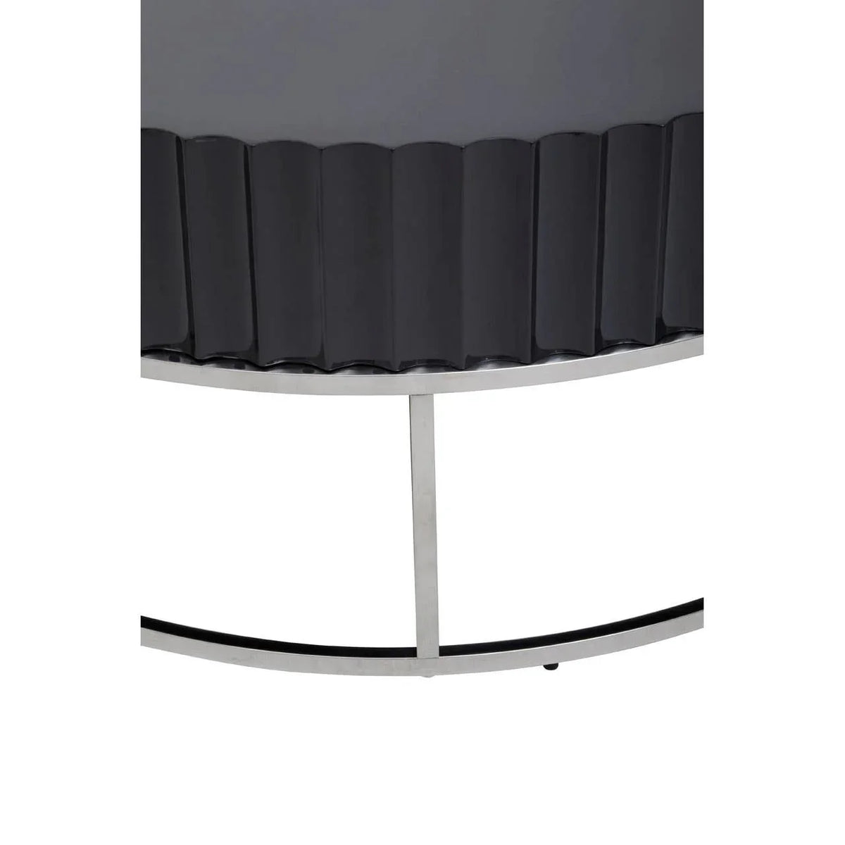 Close-up of black fluted console table with silver metal base