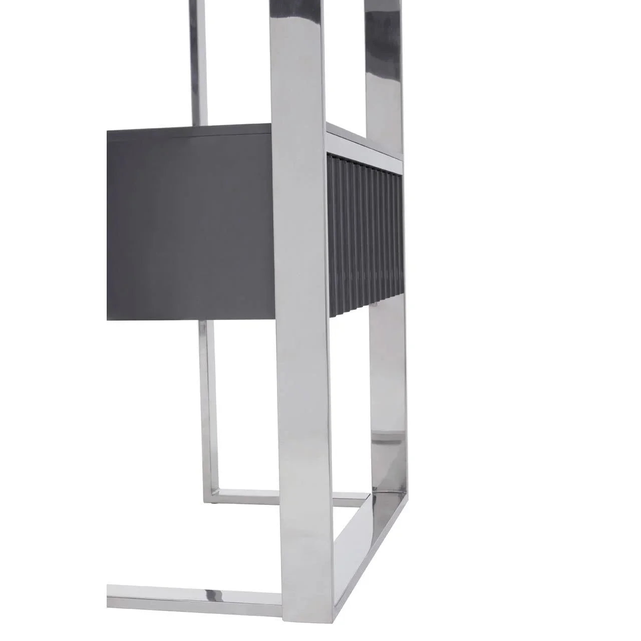 Closeup of modern console table with chrome legs and ribbed grey panel detail