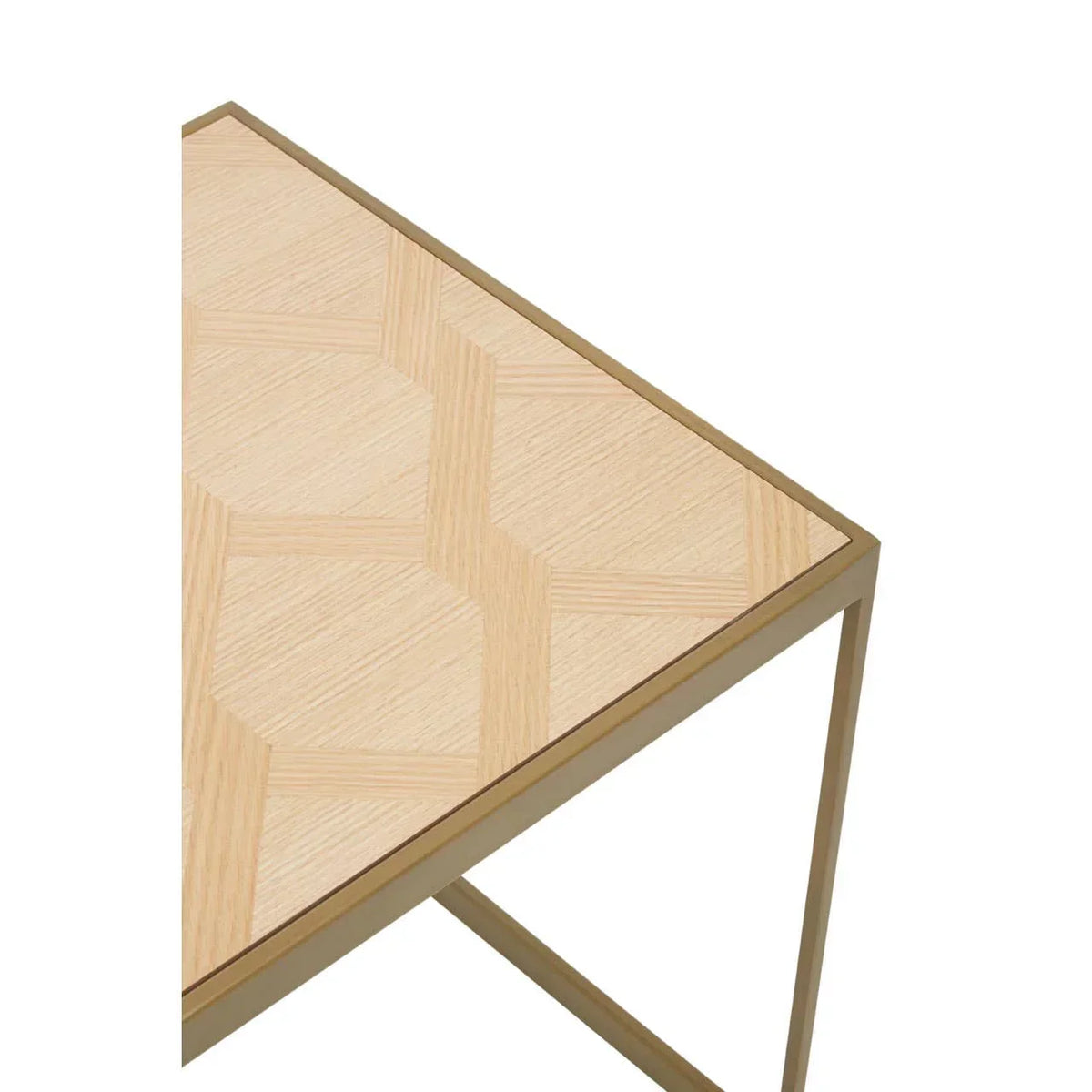 Light wood side table with geometric pattern and gold metal frame, corner detail view
