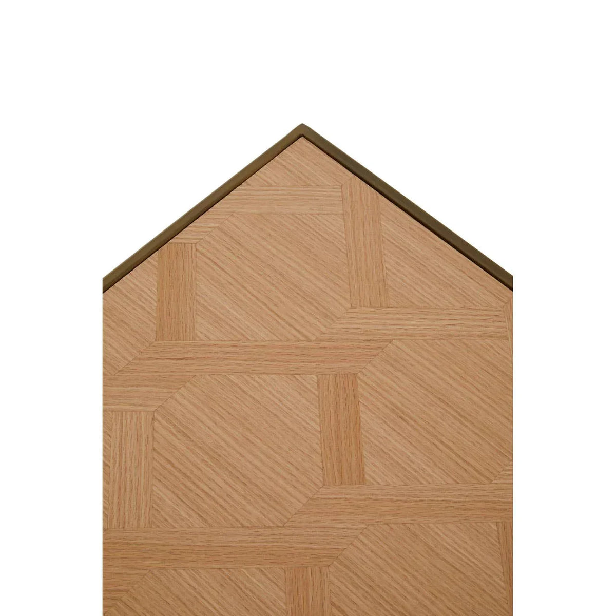 Close-up of wooden dining table top with geometric inlay pattern and angled edge