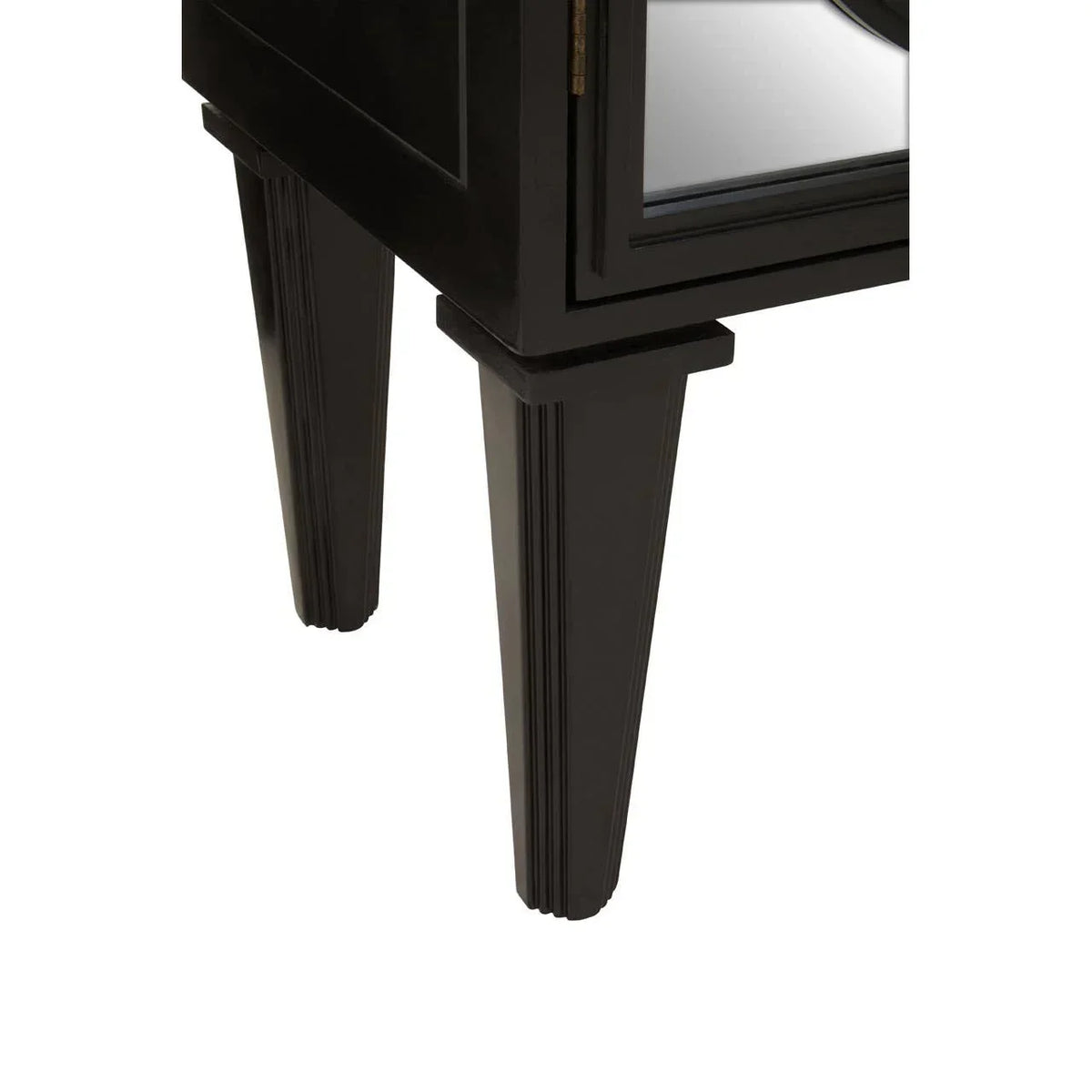 Black wooden furniture legs and mirrored cabinet panel detail