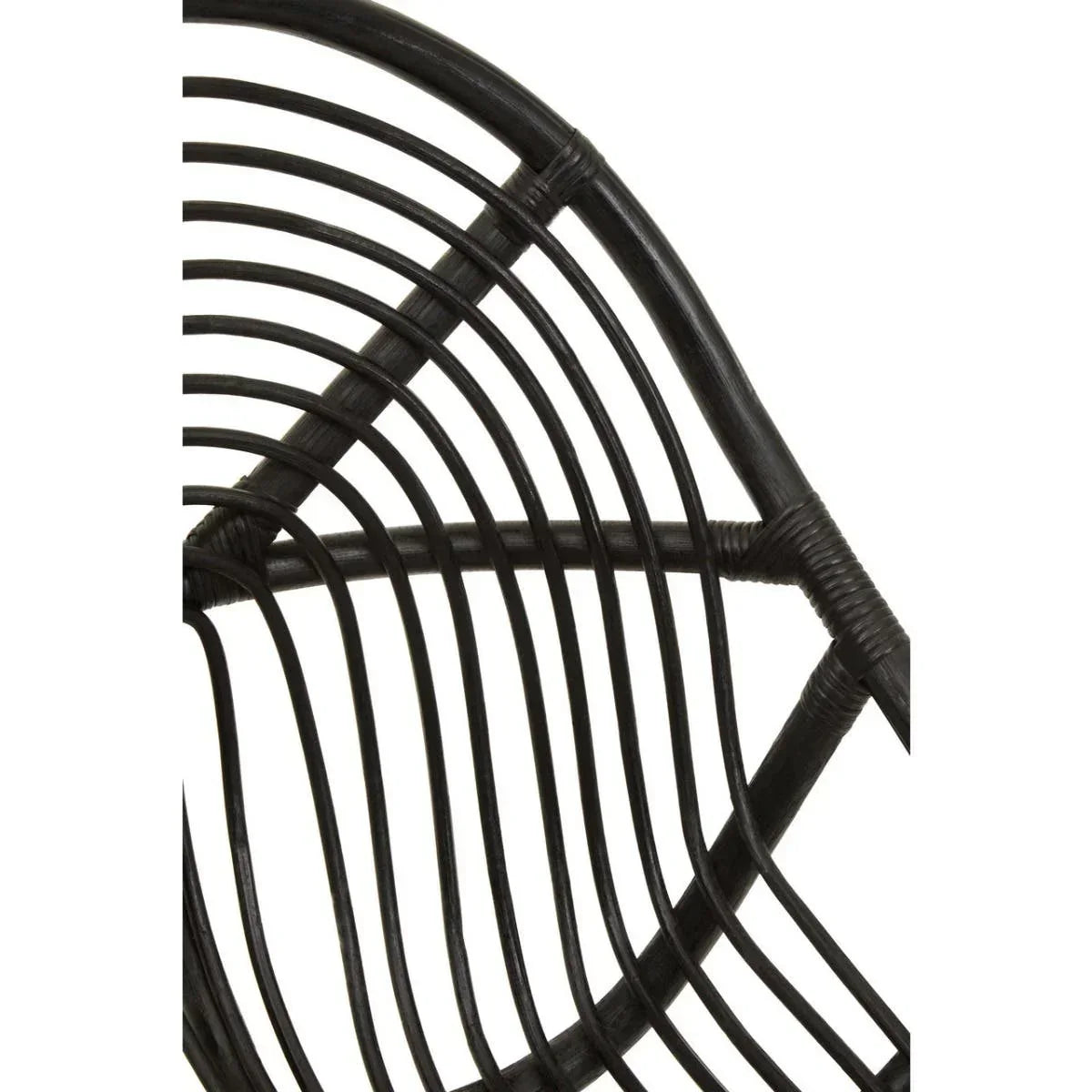 Black rattan chair frame close-up showing curved woven detailing