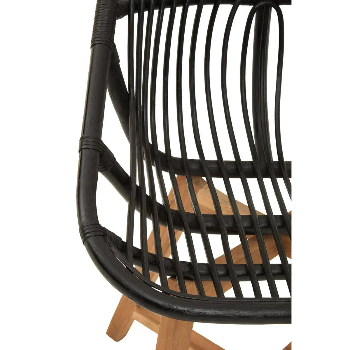 Curved black rattan chair seat with natural wood legs, close-up detail